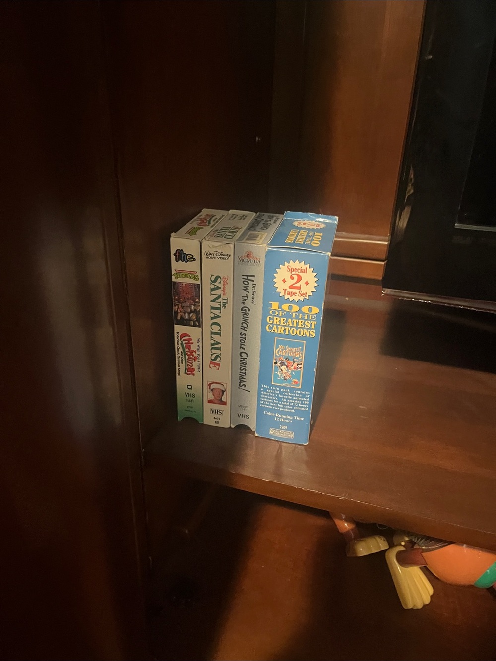Large collection of VHS tapes.